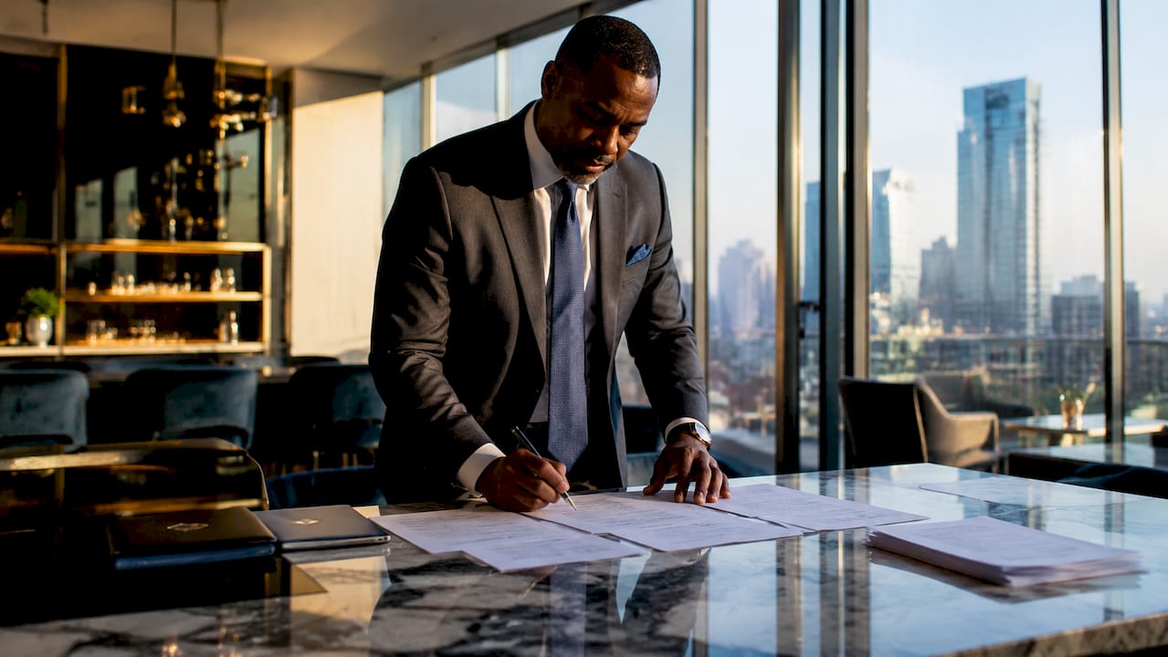 1781691217567_Investor-reviewing-construction-loan-documents Investor reviewing construction loan documents