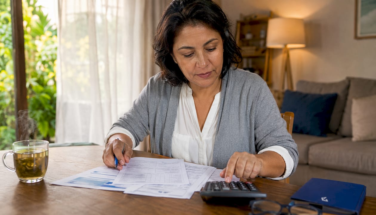1784446303806_Homeowner-reviewing-loan-documents Homeowner reviewing loan documents